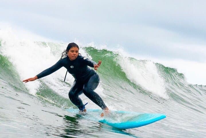 Fully engaged with the wave.