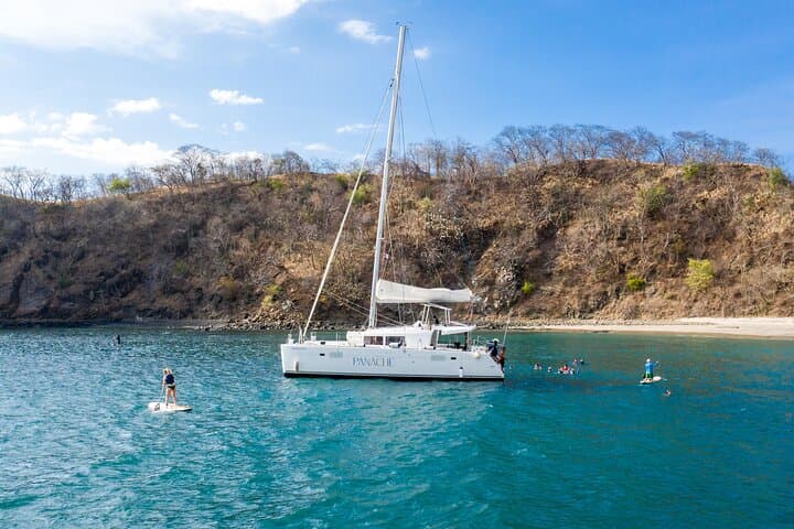 Start your day with a splash: Anchor in a secluded bay on your private morning catamaran tour in sunny Costa Rica.
