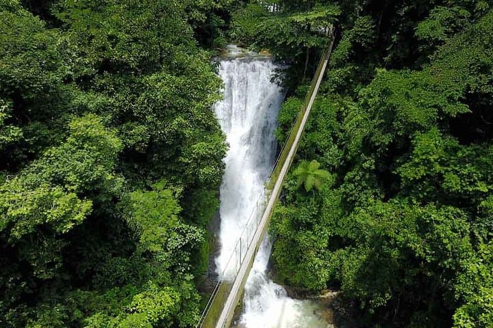 Hanging bridge over the waterfall