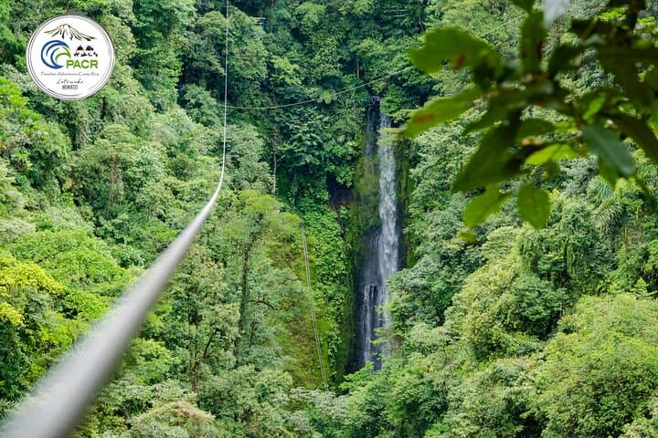 The zipline crosses the tropical canyon, bringing you to the Rappel platform next to the Pino Blanco Waterfall